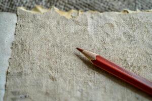 Black pencils on rough paper. Stationery background for design projects. photo