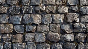 Wall of large rocks with a rough texture. Stone wall background for design projects. photo