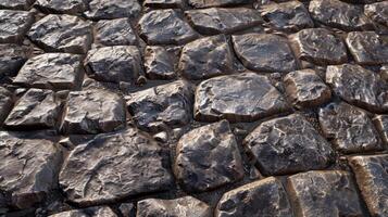 Wall made of large rocks. Natural stone background. photo
