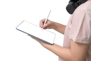 hand using stylus pen on mini digital tablet on white table background photo
