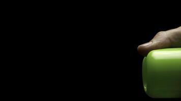 Sprayed air freshener in hand isolated on black. Automatic Air Freshener Isolated on Black Background. air freshener spray in front of black background photo