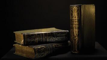 Vintage books with dark leather binding and patterns on isolated background. Stock footage. Old book with simple gilded patterns on cover photo