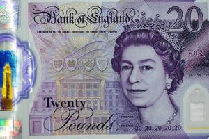 A twenty pound note with the image of queen elizabeth on it photo