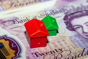 Red and Green House Models on a Twenty Pound Note photo