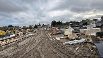 Construction Site with Building Materials and Overcast Sky photo
