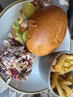 Delicious Burger with Fries and Coleslaw photo