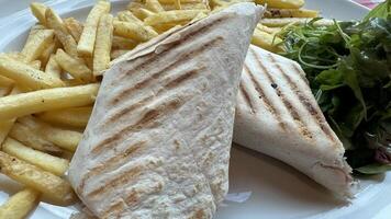 Grilled Wraps with French Fries and Salad photo