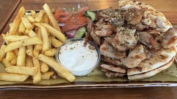 Grilled Meat Platter with Pita and Fries photo