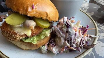 Crispy Fried Sandwich with Coleslaw and Pickles photo