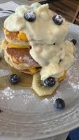 Delicious Pancake Stack with Fresh Fruits photo