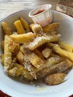 Cheesy French Fries with Ketchup photo