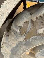 Close-Up of a Muddy and Worn Tire photo