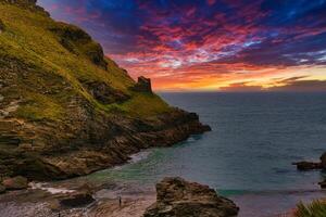 Vibrant Sunset Over Coastal Cliffs in Tintagel, Cornwall, UK photo