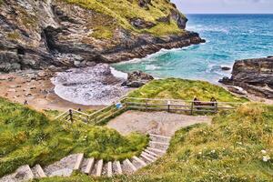 Scenic Coastal View with Sandy Beach and Cliffs in Tintagel, Cornwall, UK photo