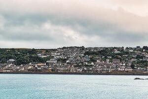 Coastal Town Overlooking Calm Sea in Penzance, Cornwall, UK photo