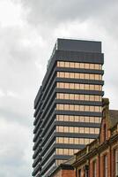 Modern High-Rise Building Against Cloudy Sky in Leeds, UK photo