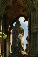 Cloaked Statue in Ornate Archway in Harrogate, UK photo