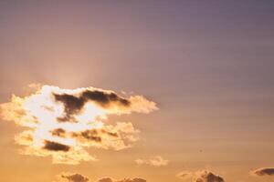 Serene Sunset with Illuminated Clouds photo
