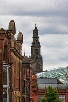 Historic City Street with Clock Tower in Leeds, UK photo