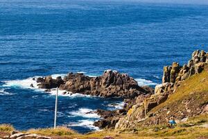 Scenic Coastal View with Rocky Cliffs at Land's End in Cornwall, UK photo