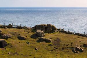 Coastal Landscape with Rocks and Ocean View at Land's End in Cornwall, UK photo