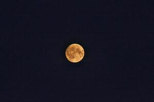 Bright Full Moon in Night Sky in Harrogate, UK photo