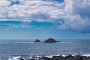 Serene Seascape with Rocky Islands at Cape Cornwall photo