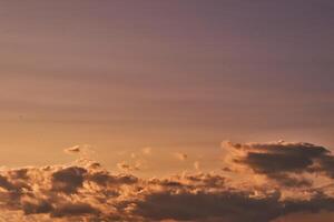 Serene Sunset Sky with Soft Clouds photo