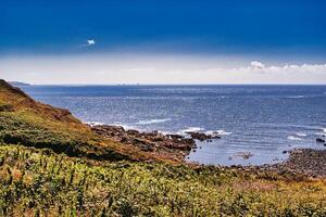 Scenic Coastal View with Rocky Shores at Land's End in Cornwall, UK photo