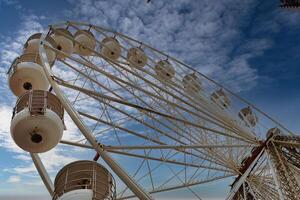 Close-Up of a Ferris Wheel Against a Blue Sky in Blackpool, UK photo