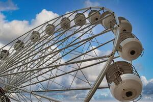 Close-Up of a Ferris Wheel Against a Blue Sky in Blackpool, UK photo