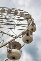 Close-Up of a Ferris Wheel Against a Cloudy Sky in Blackpool, UK photo