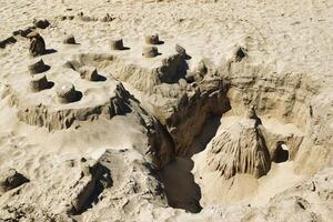 Intricate Sandcastle on the Beach in Cornwall, UK photo