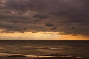 Dramatic Sunset Over the Ocean in Blackpool, UK photo