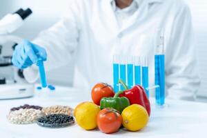 Scientist check chemical fruit residues in laboratory. Control experts inspect the concentration of chemical residues. hazards, standard, find prohibited substances, contaminate, Microbiologist photo