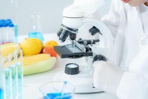 Scientist check chemical fruit residues in laboratory. Control experts inspect the concentration of chemical residues. hazards, standard, find prohibited substances, contaminate, Microbiologist photo