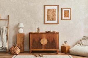 Design of neutral living room with stylish retro commode, mock up poster frame, cube, table lamp, decoration and elegant personal accessories in home decor. Template. Japandi concept. photo