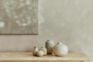 Stylish minimalistic monochromatic composition with design vases and accessories. Poster on the wall, copy space. Neutral colors. Template. photo
