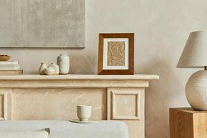 Stylish minimalistic composition of living room interior with wooden poster frame, design vases, elegant lamp on the wooden cube and personal accessories. Neutral colors. Template. photo