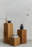 Creative composition of stylish spacious living room with wooden cubes, lamp, design vase and small personal accesories. Japandi style. Details. Copy space. Template. photo
