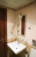 Interior of bathroom with sink basin,Modern bathroom in luxury house,Modern wash basin in the bathroom photo