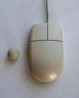old disassembled computer mouse with a ball photo