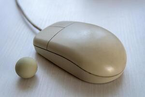 old disassembled computer mouse with a ball photo