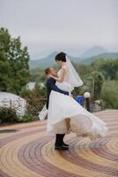 A bride and groom are standing on a brick walkway photo