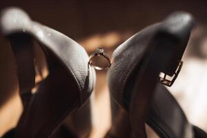 A pair of shoes with a ring on them photo