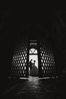 A couple is standing in front of a door photo