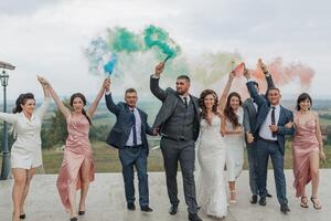 A group of people are posing for a photo, with some of them holding smoke bombs photo
