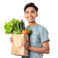 Smiling young man holding groceries vegetable shopping bag standing isolate on transparency background png