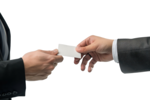 Two hands exchanging a business card in a professional setting, symbolizing networking, business connections, and corporate communication. png