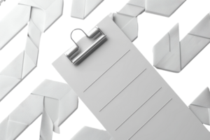 Top view of a blank white clipboard with a chrome clip on a patterned background of folded white paper arrows. png